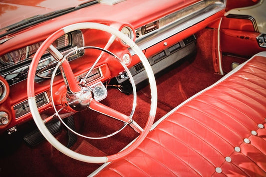 Classic car interior showcasing elegant red leather seating