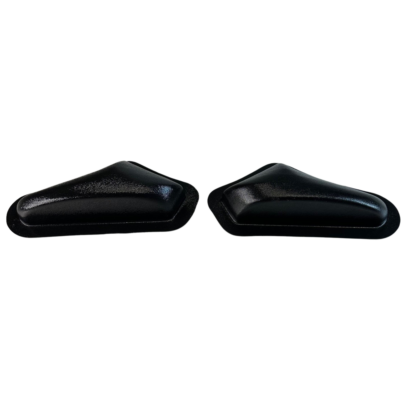 Two black plastic car door handles on a white background
