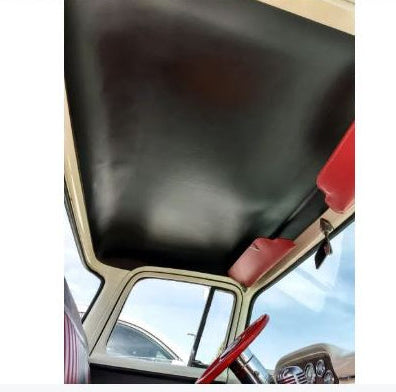 Black rubberless headliner installed inside the cab of a vintage Ford truck