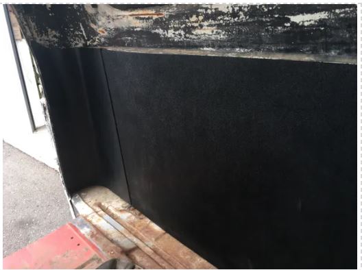 Rear cab cover installed in Chevrolet truck cab, shown from an alternate angle