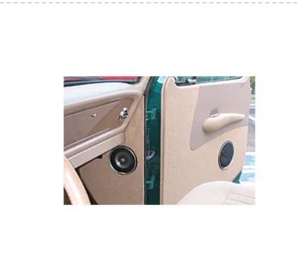 Car door interior with speakers and handle on a white background