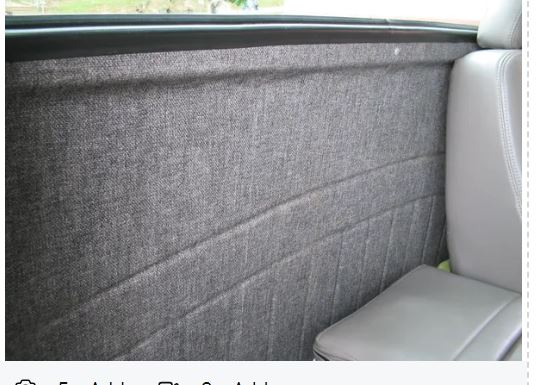 Car interior with gray fabric panel and seat