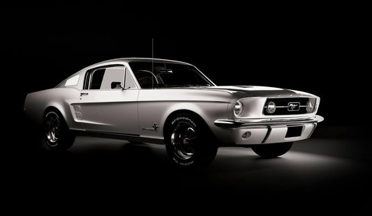 Side profile of a Ford Mustang GT500 emphasizing its sporty silhouette and bold color