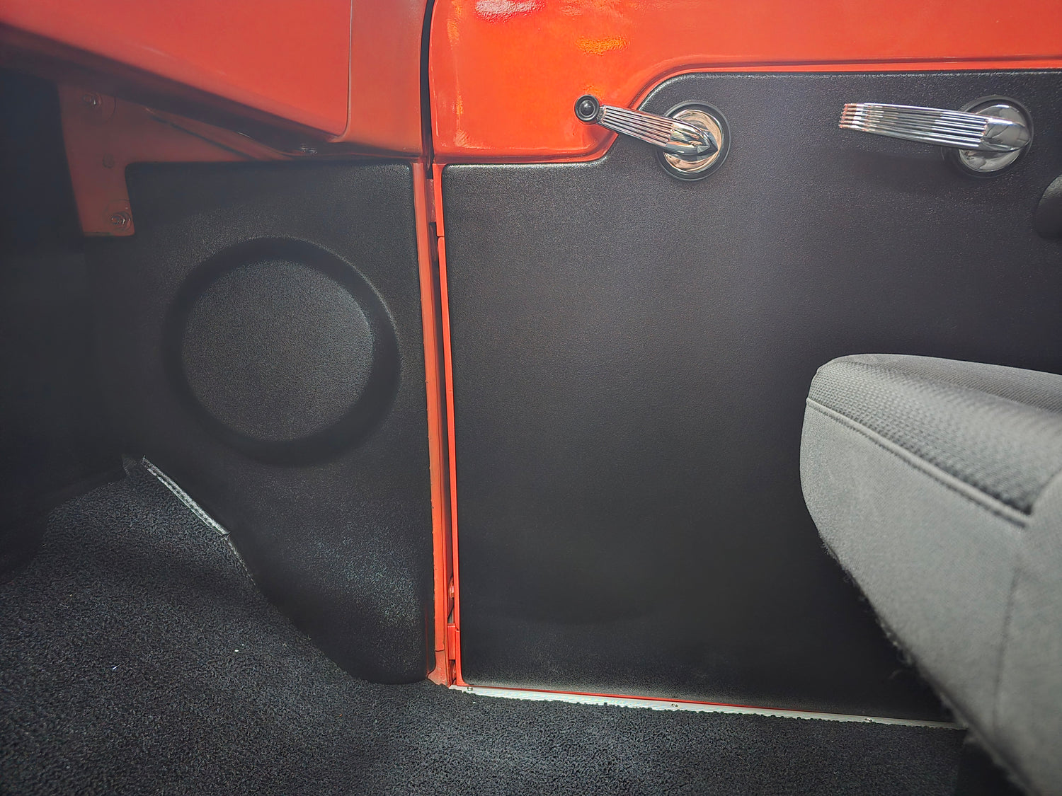 Car door kick panel with a speaker for 1953, 1954, and 1955 Ford trucks showing the interior design.