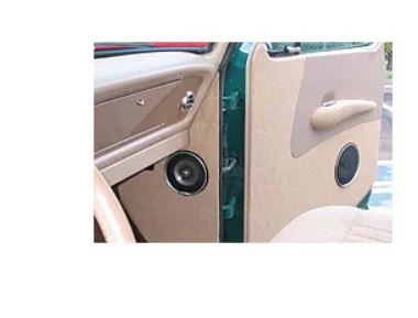 Modular armrest installed in tan vehicle door panel, shown with speaker grille and interior trim