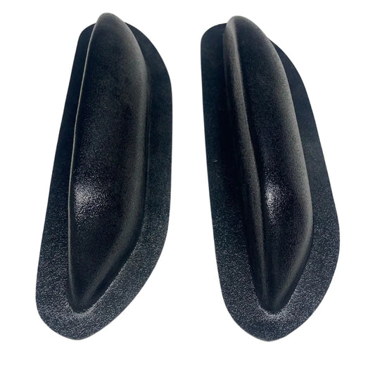 Pair of unfinished black ABS universal modular armrests, angled side-by-side view
