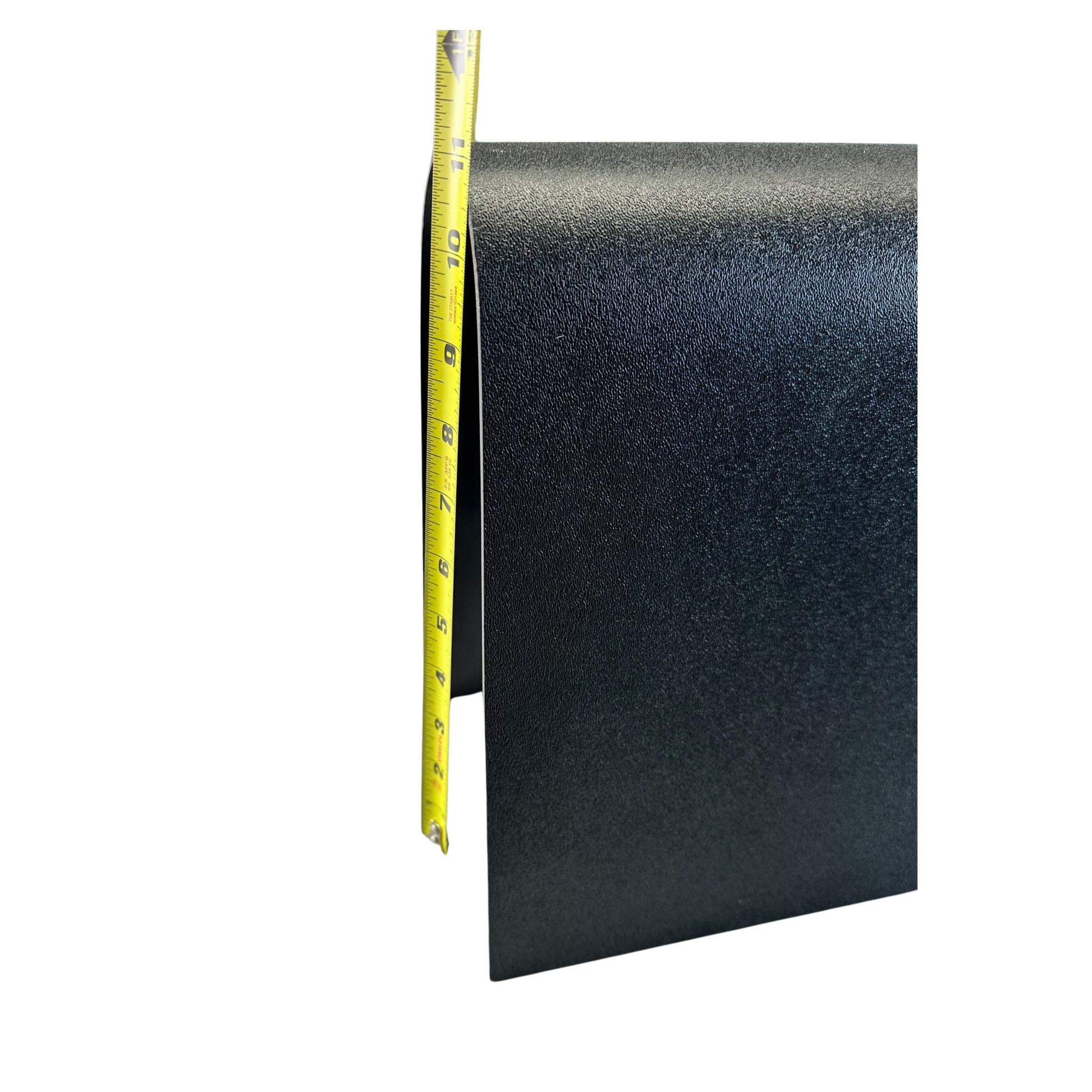 Black rubber mat with a measuring tape on a white background