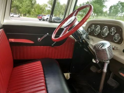Interior view of red installed ABS door panels for 1957–1960 Ford trucks with modular 13-inch armrests