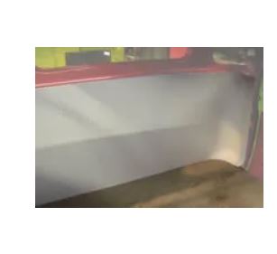 Rear cab cover for 1957-1960 Ford Truck, displayed in a workshop setting, primarily white in color with visible mounting points and a clean, flat surface.
