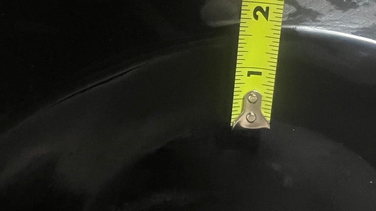 Close-up of 1968–1972 Chevrolet C/K Series trucks ABS kick panel with measuring tape.