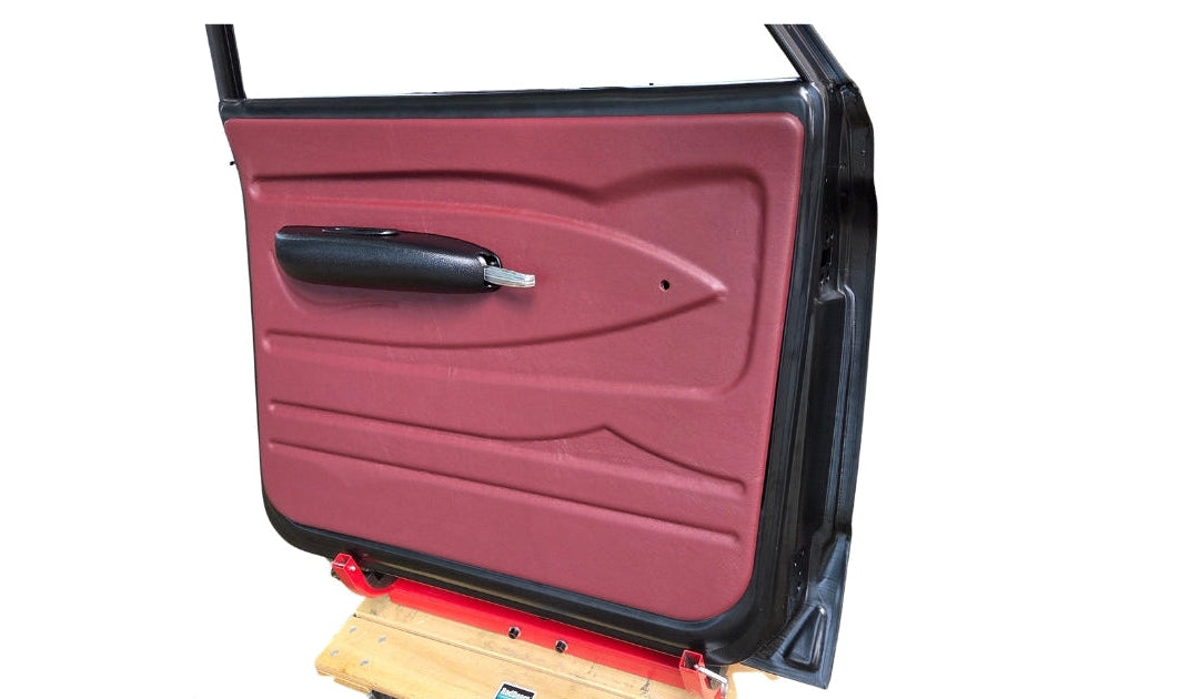 Car door panel in oxblood red Ultraleather material on a white background