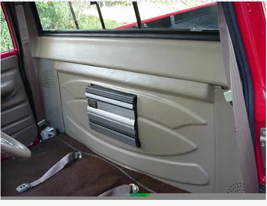 Rear cab cover installed on the interior rear side of a Chevrolet truck, replacing the space of the removed gas tank.
