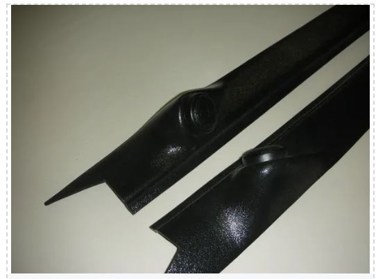 Two black metal brackets on a light gray background
