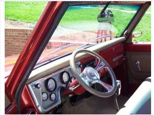 Car interior with steering wheel and dashboard view
