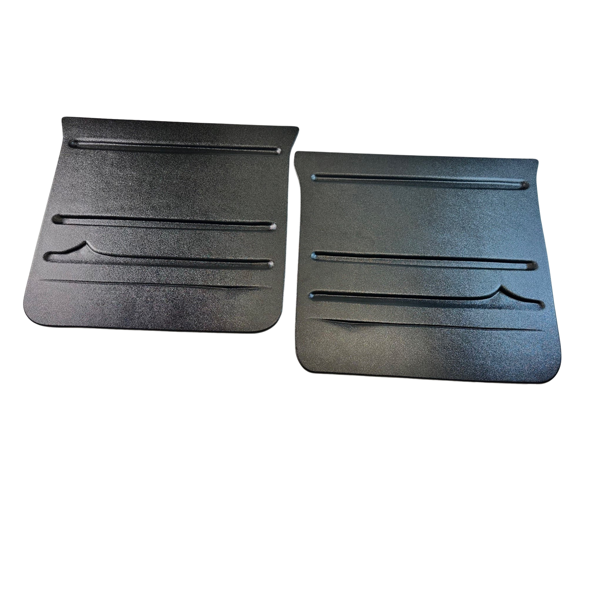 Two black rubber car floor mats on a white background