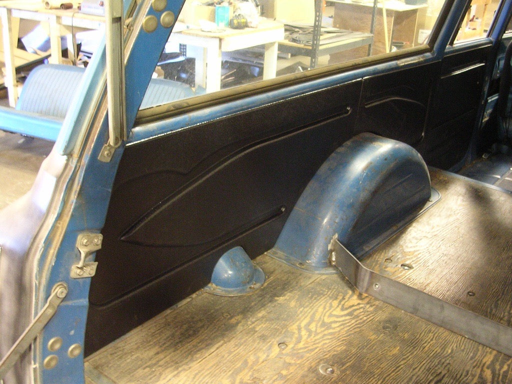 ABS quarter panel installed in rear cabin of 1967-1972 Chevy Suburban, shown in vehicle interior