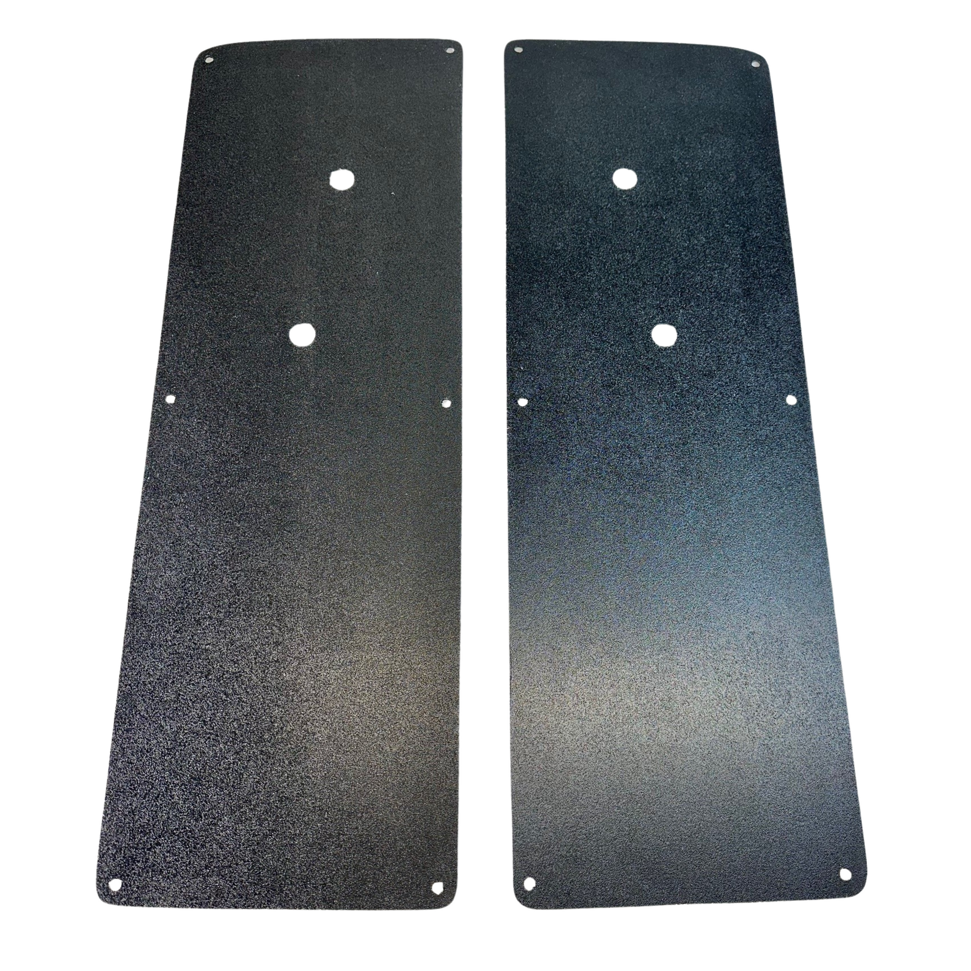 Two black metal plates with holes on a white background