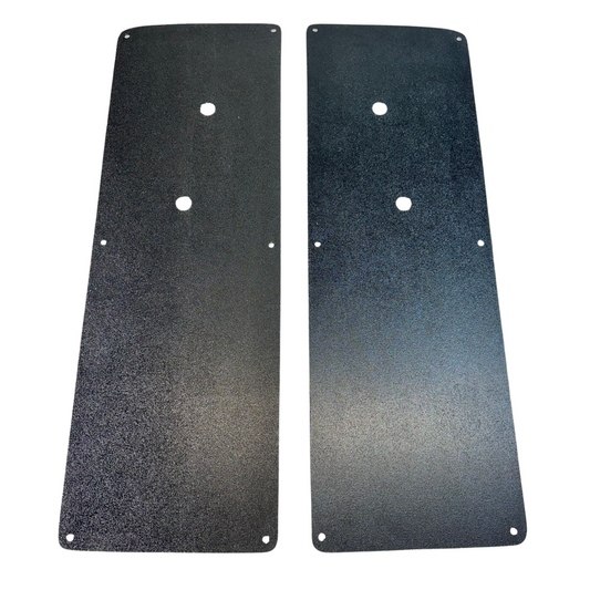 Two black metal plates with holes on a white background