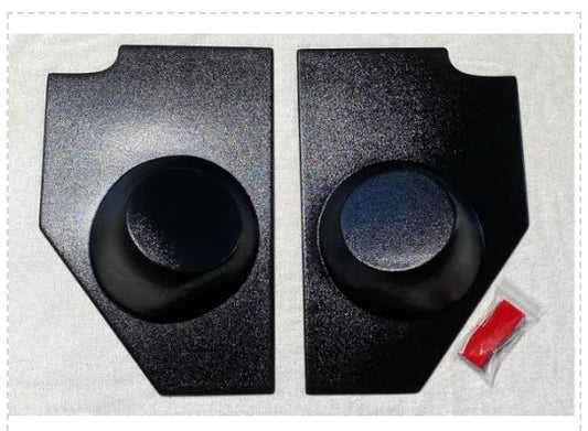 A pair of black kick panels with speaker pods for 1947-1955 Chevrolet trucks, including a small red accessory.