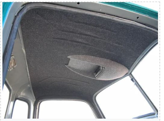 An interior view of a vehicle headliner made of black material, installed inside the truck's cabin