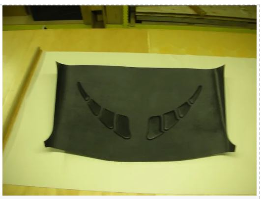 Black car hood scoop on a white background
