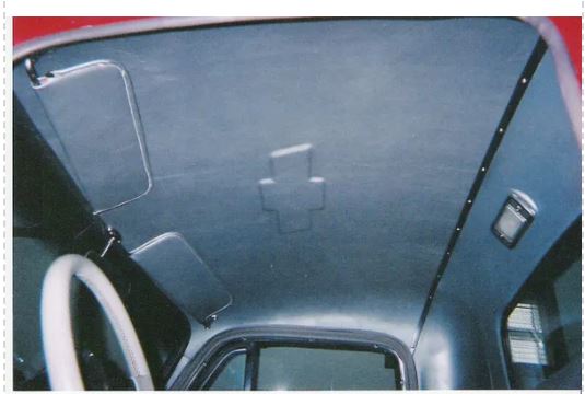Car interior with a visible logo on the dashboard