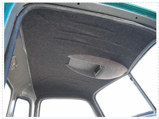Interior view of a vehicle headliner made from black ABS plastic, showing the material installed on the vehicle's interior roof panel.