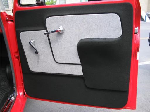 A photo showing a pair of black and gray door panels with armrests installed on a red vehicle's door, demonstrating the product's use.