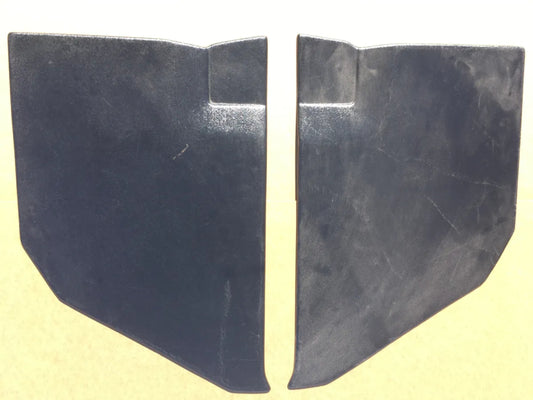 A pair of black unibody kick panels for 1961-1963 Ford trucks.