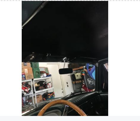 Garage interior with car interior and shelves.