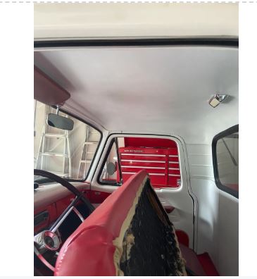 Interior of a vehicle with red and white interior