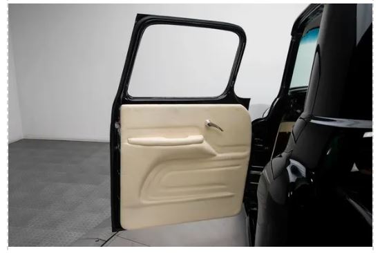 Beige Rod Doors’ 1955–1959 Chevrolet Truck Kobi‑Style Door PanelCar door panel installed on a black truck on a white background
