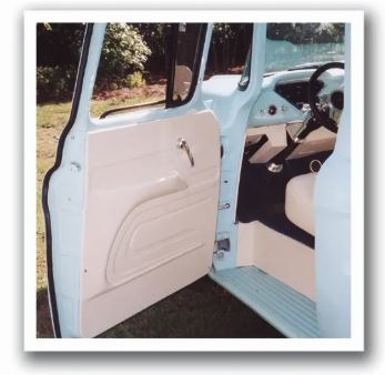Open door of a vintage truck showing a beige Rod Doors’ 1955–1959 Chevrolet Truck Kobi‑Style Door Panel