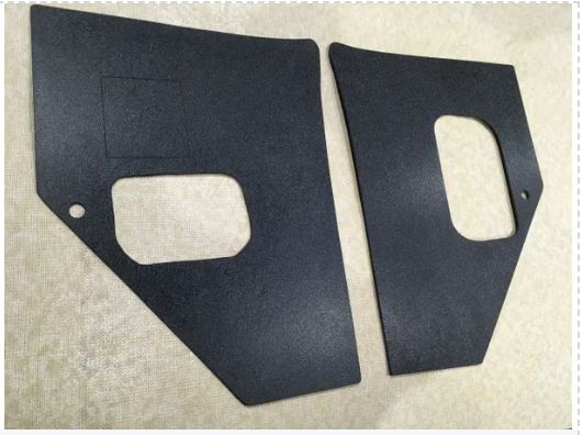 Pair of black textured ABS flat kick panels for 1955-1959 Chevrolet Truck, with vent hole cutout visible
