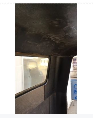 Close-up of an installed black headliner in 1955–1959 Chevrolet truck