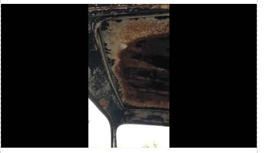 Close-up of a headliner that is worn and needs to be replaced