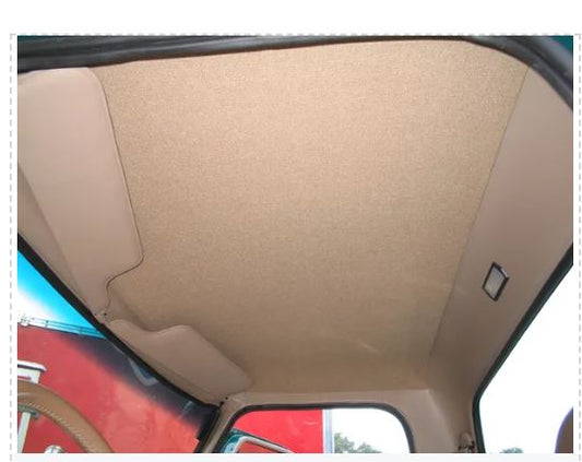 Beige headliner installed inside the interior of a vehicle, likely made from ABS plastic.