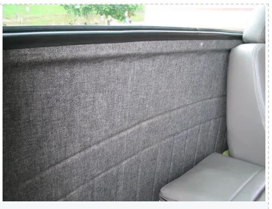 Car interior with gray textured door panel and seat