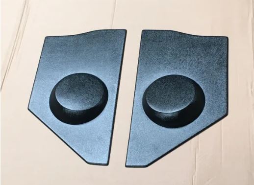 A pair of black kick panels with integrated speaker pods for 1948-1952 Ford trucks.