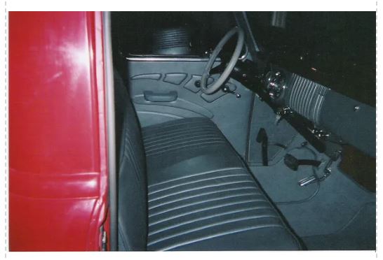 RD3240 Quinn style door panels installed in red 1947-1955 Chevrolet truck — full interior view showing driver and passenger side panels