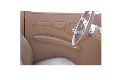 Close-up of a car's beige interior with a steering wheel