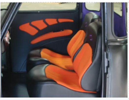 Car interior with orange and black seat covers