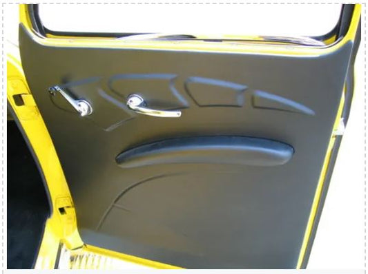 A black door panel for a 1947-1955 Chevrolet Truck, with a visible door handle and part of the window frame.