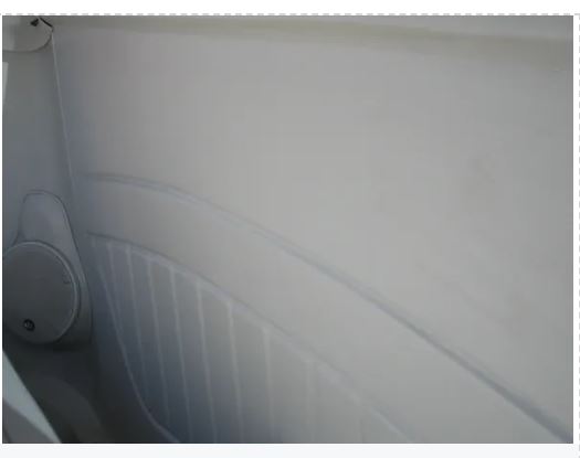 Close-up of a car's interior door panel with a visible air vent.