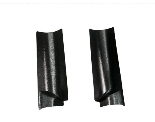 Two black plastic parts on a white background