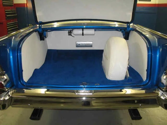Open trunk of a 1955–1957 Chevrolet Sedan showing the RD3311 ABS trunk panels installed.