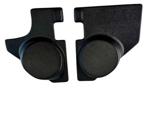 Two black rubber corner protectors on a white background