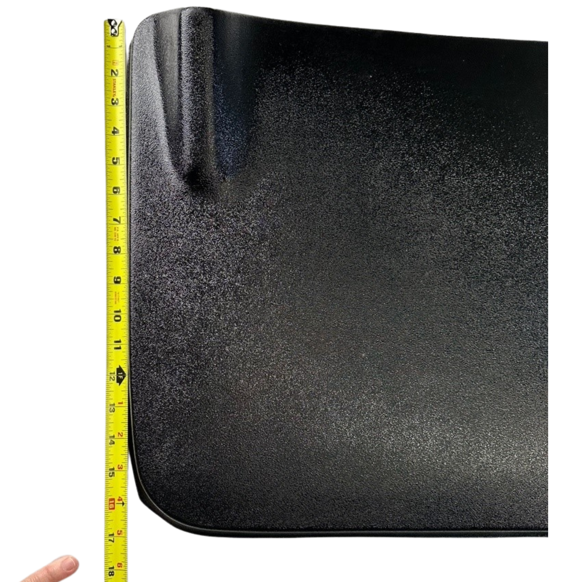 Black mat with a yellow measuring tape on the side