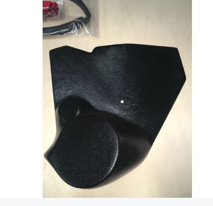 Black car mat on a light surface