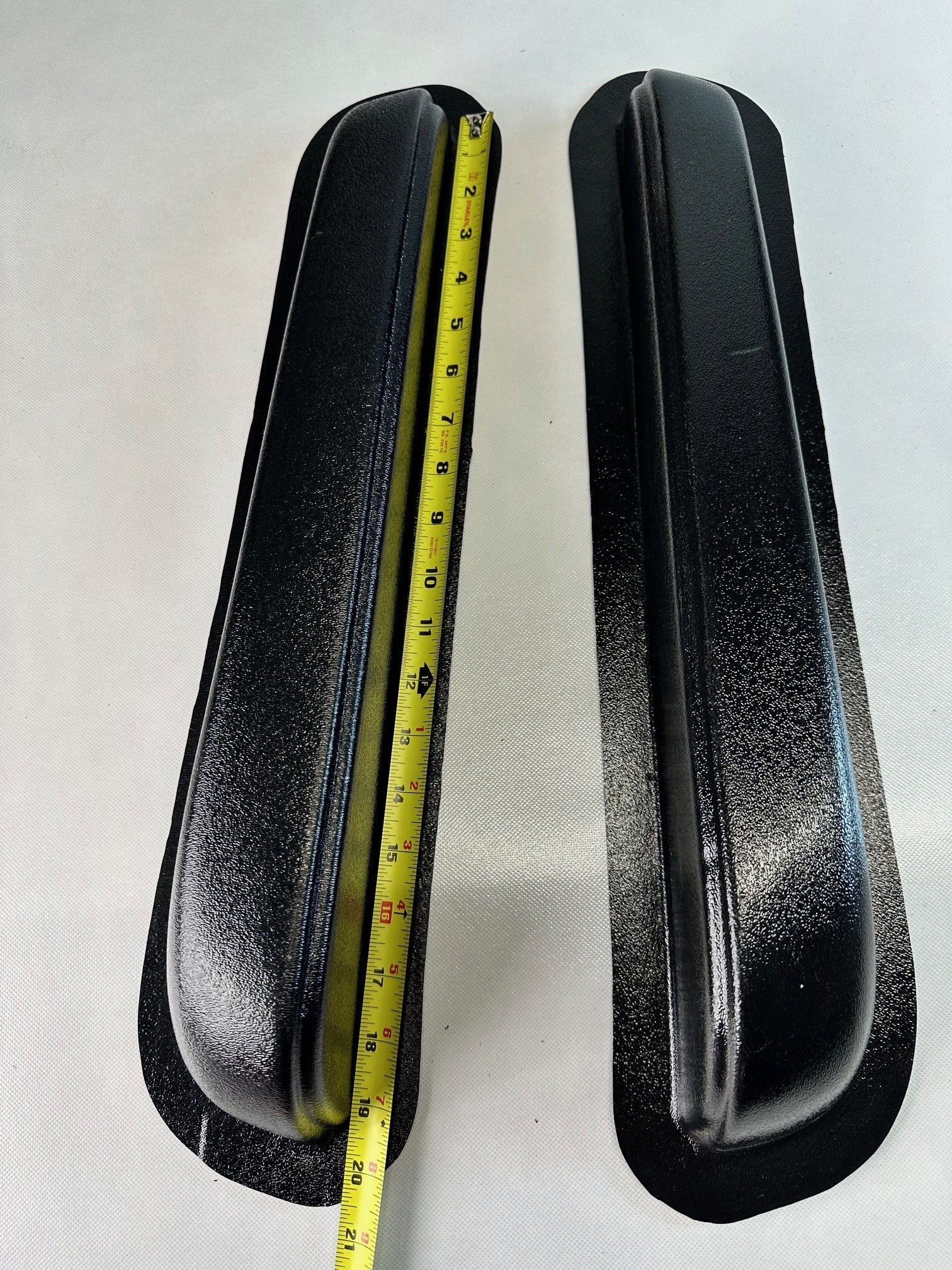 Two black Rod Doors universal modular Fresno‑style armrests, 19.5 inches long, sold as a pair with a measuring tape for scale on a white background